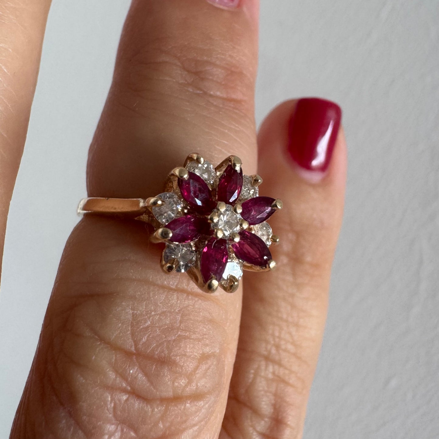 14K gold ring featuring a classic floral-inspired design set with marquise-cut Rubies & Diamonds.
