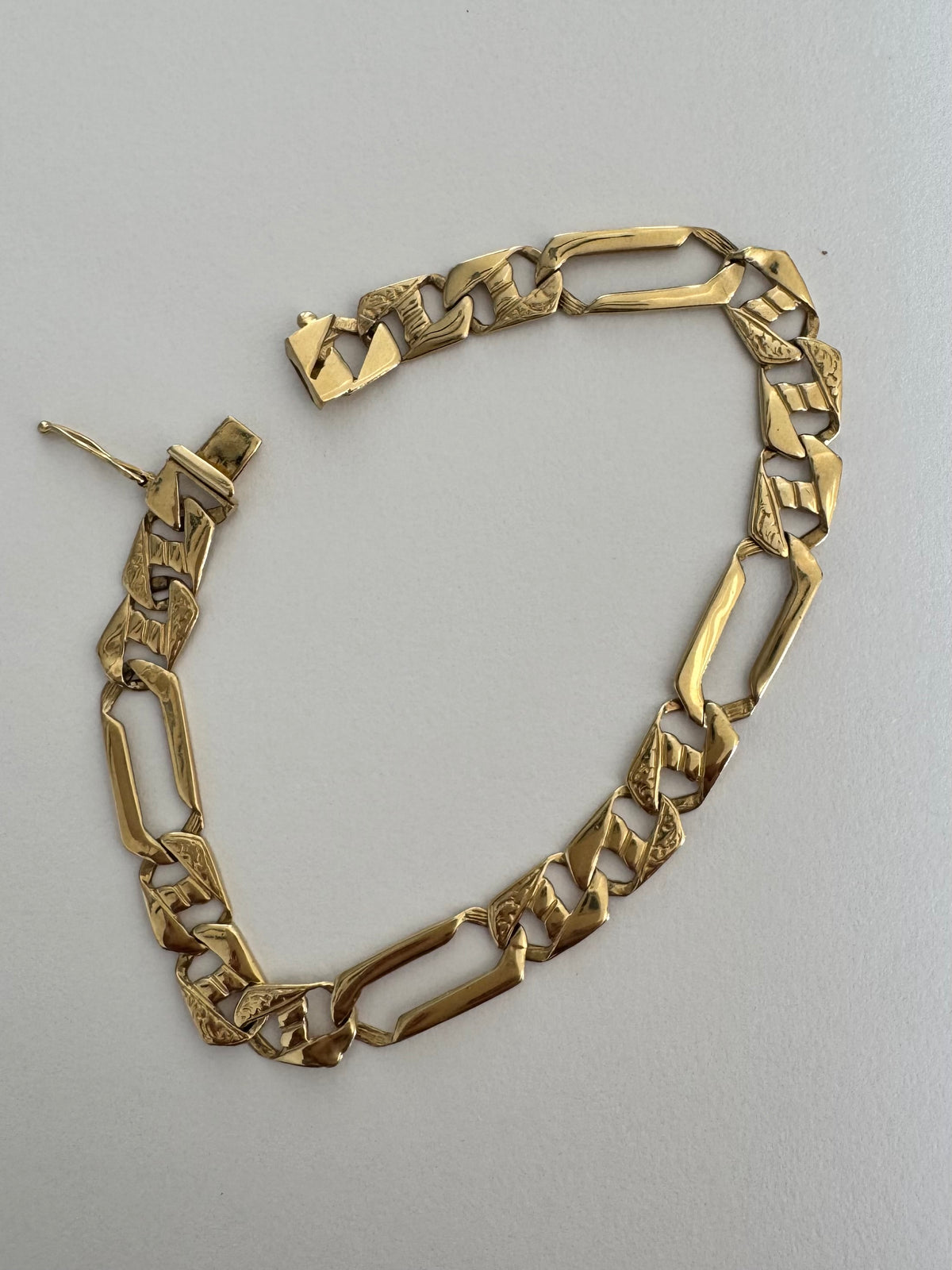 14K gold bracelet with a modern, distinctive link design
