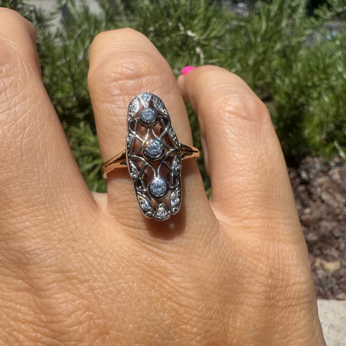 14K gold ring set with diamonds in an elongated openwork design