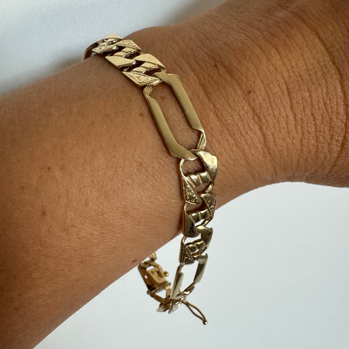 14K gold bracelet with a modern, distinctive link design