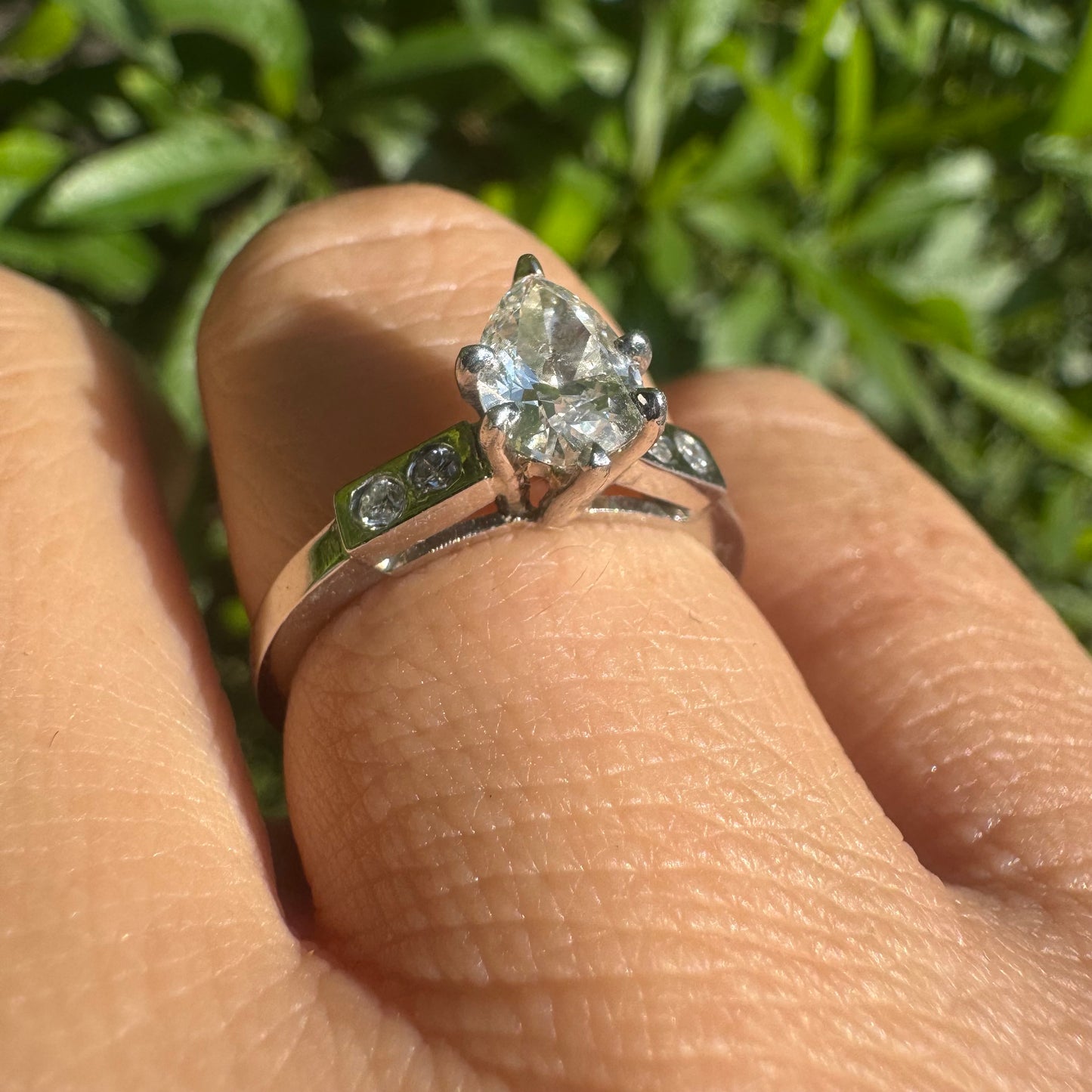 Platinum ring set with one center Pear cut Diamond & side Diamonds