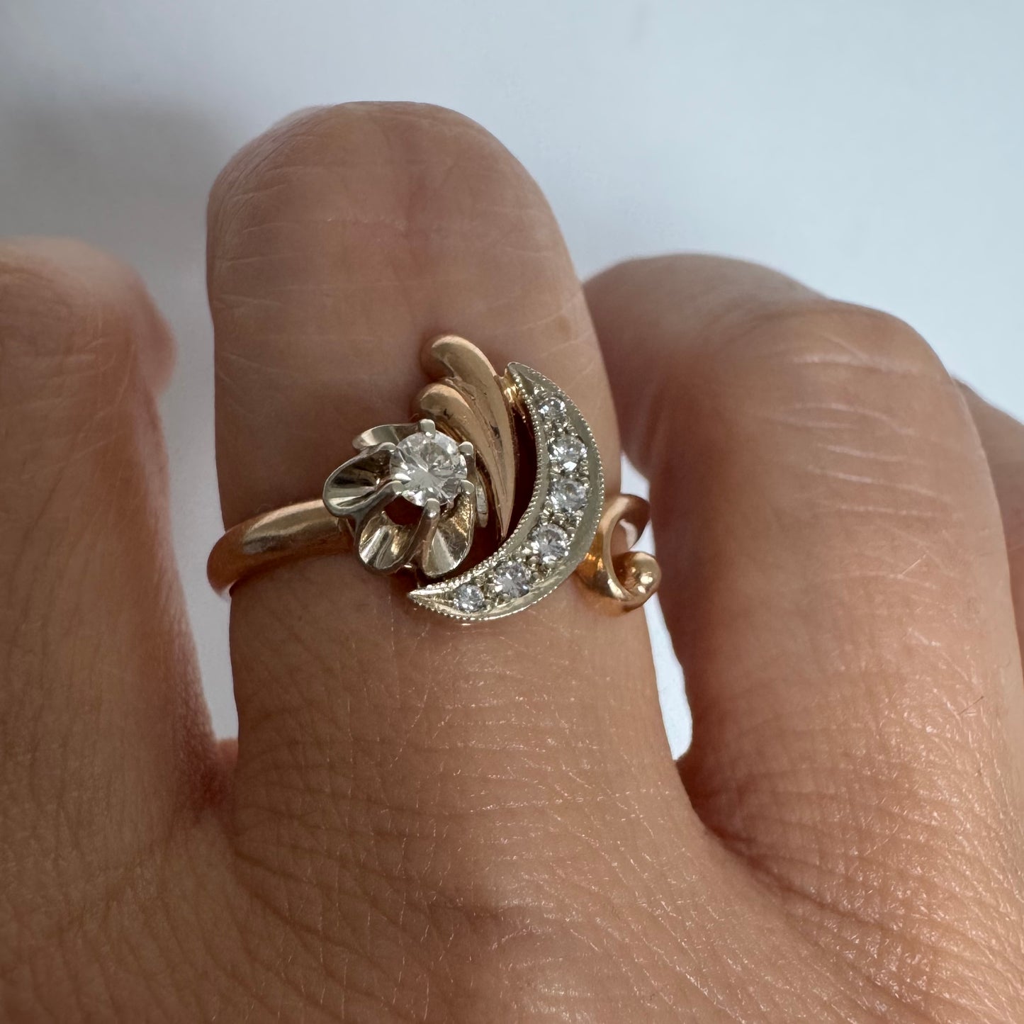 14K gold ring with a delicate moon and star motif set with Diamonds
