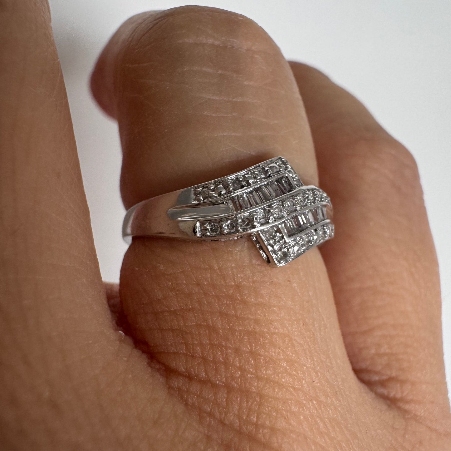 9K gold ring set with natural Diamonds in a unique geometric design.