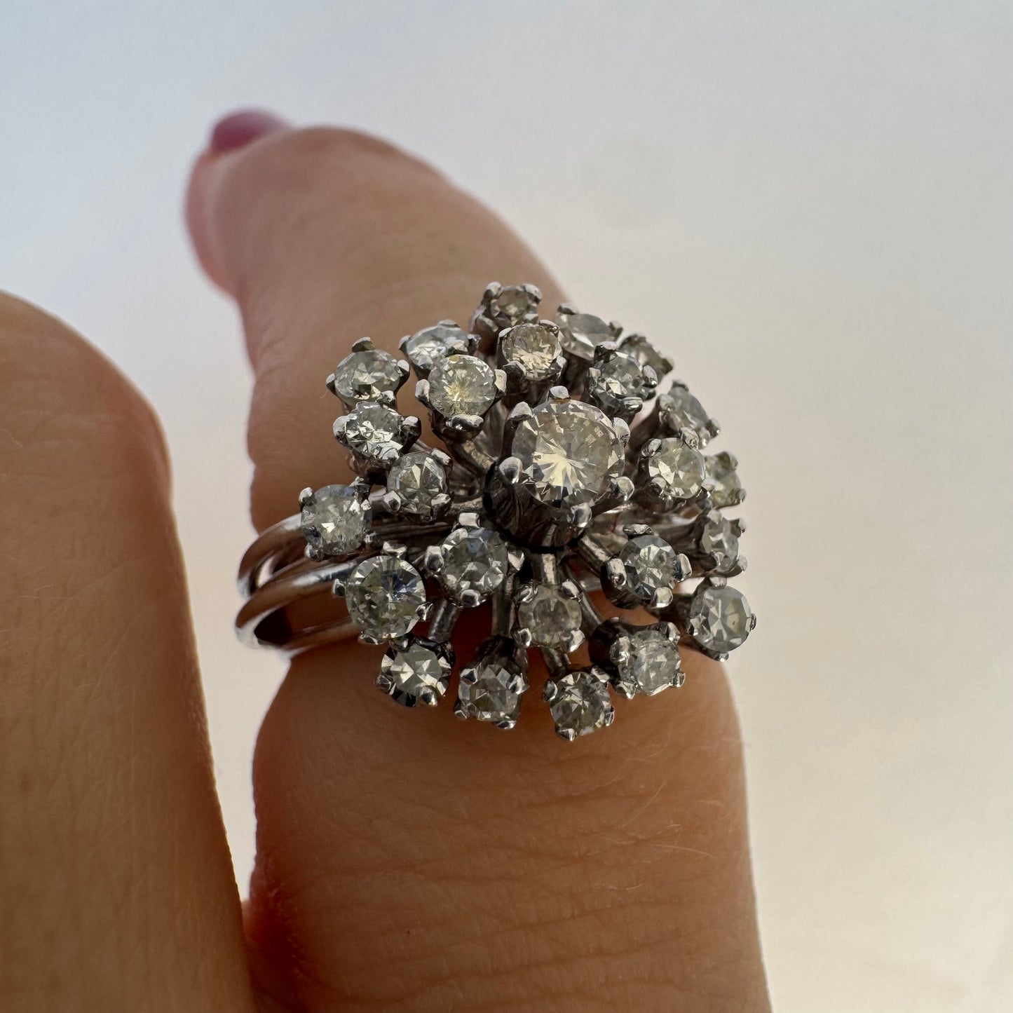 14K gold ring set with a cluster of sparkling Diamonds in a rich floral-inspired design.