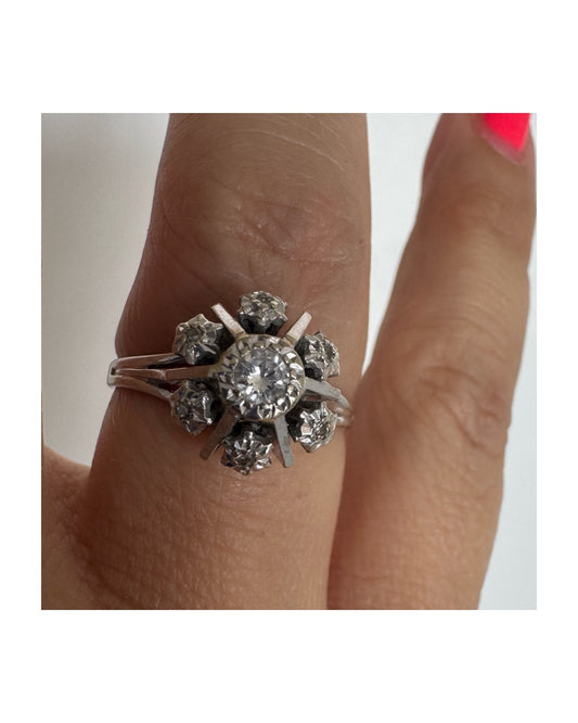 18K white gold ring set with Diamonds in a timeless floral design.
