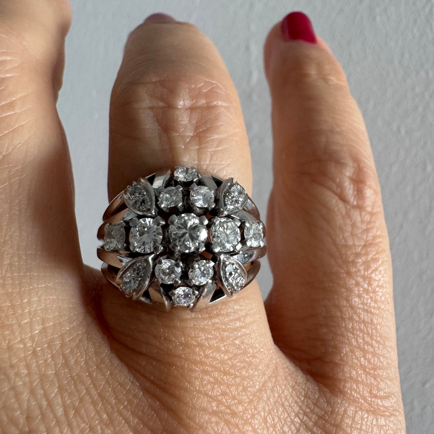 Platinum ring set with Diamonds in a bold, multi-layered floral design.