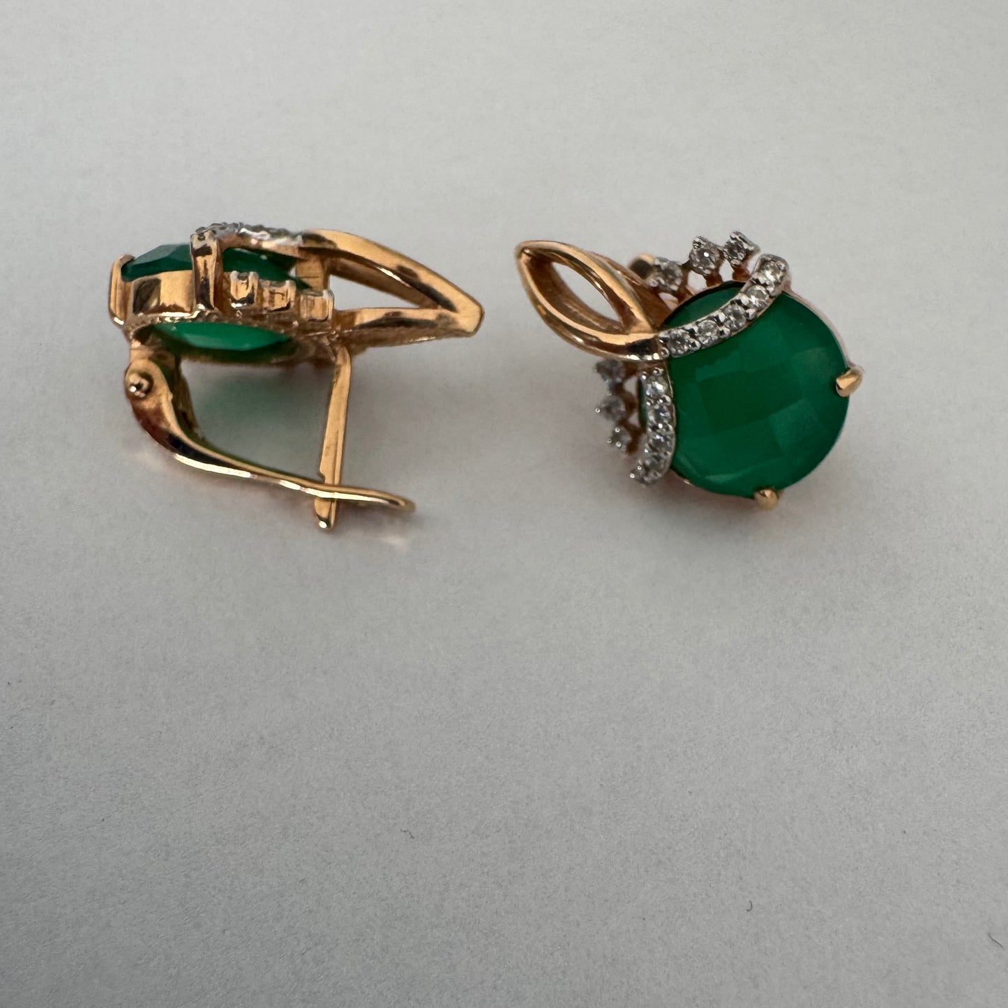 14K gold earrings set with vibrant green stones
