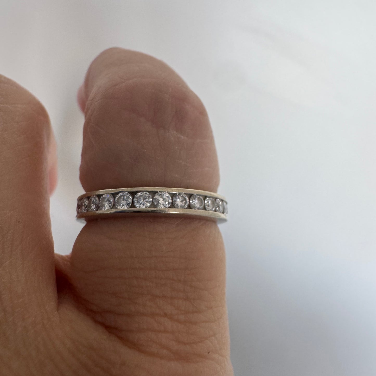 14K white gold eternity ring set with a row of sparkling Diamonds