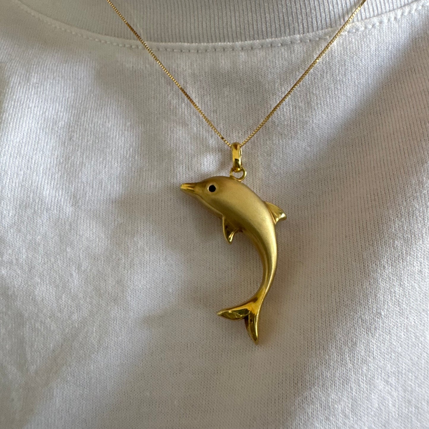 14K gold dolphin pendant with a smooth & polished finish.