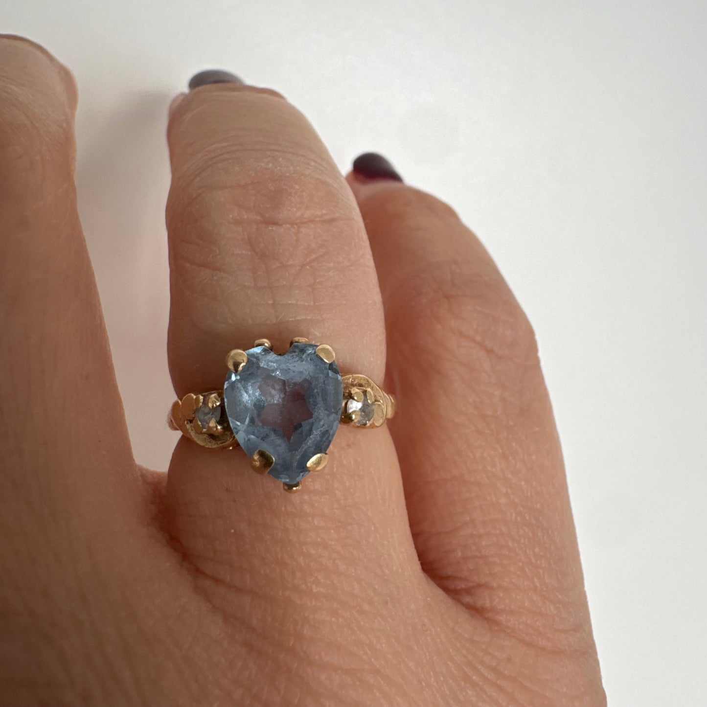 14K gold ring set with a heart-cut Blue Topaz stone