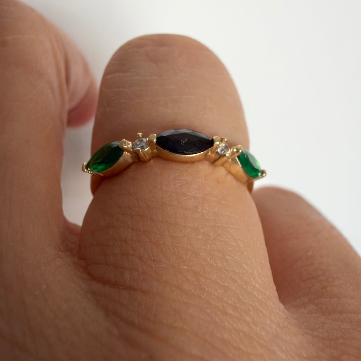 14K yellow gold vintage ring with a marquise-cut sapphire and emeralds