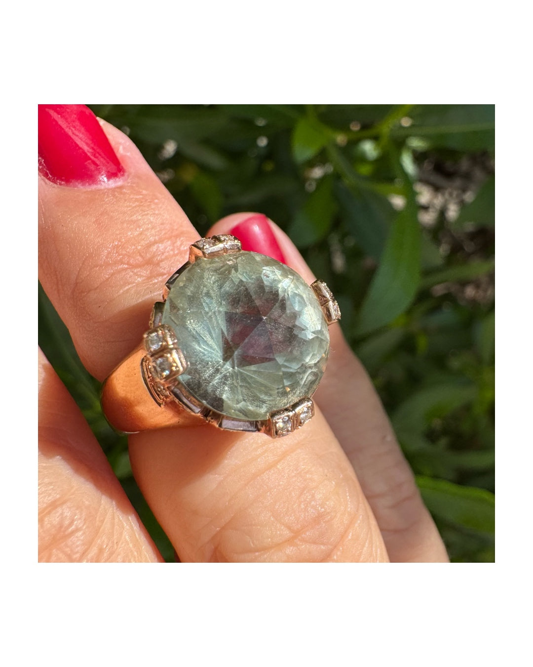 18K gold ring set with a large round Prasiolite gemstone accented by small Diamonds