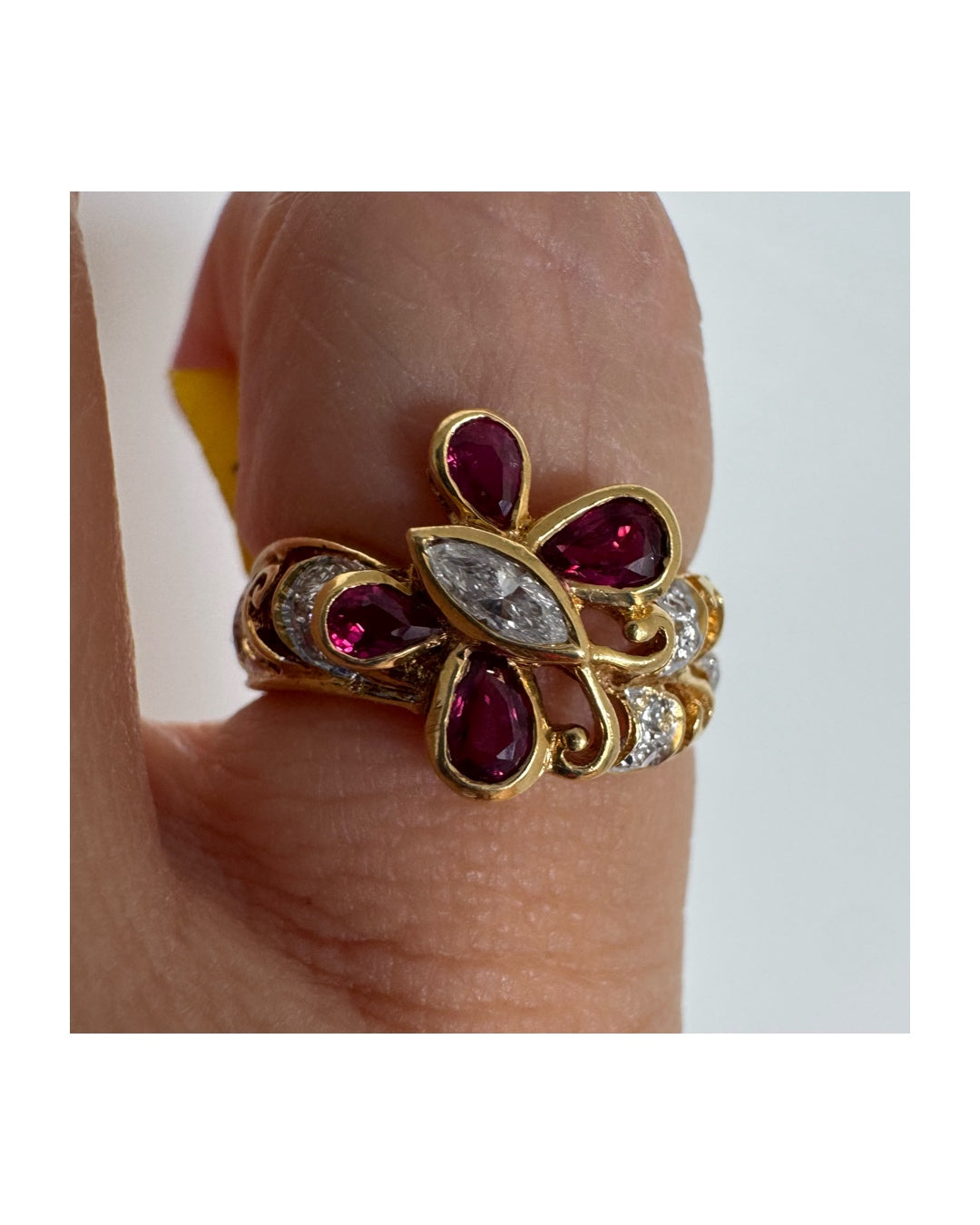 18K gold butterfly ring set with pear-cut Rubies & a marquise-cut Diamond at its center