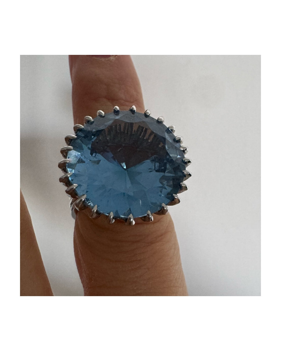 14K gold statement ring set with a large Blue Topaz stone