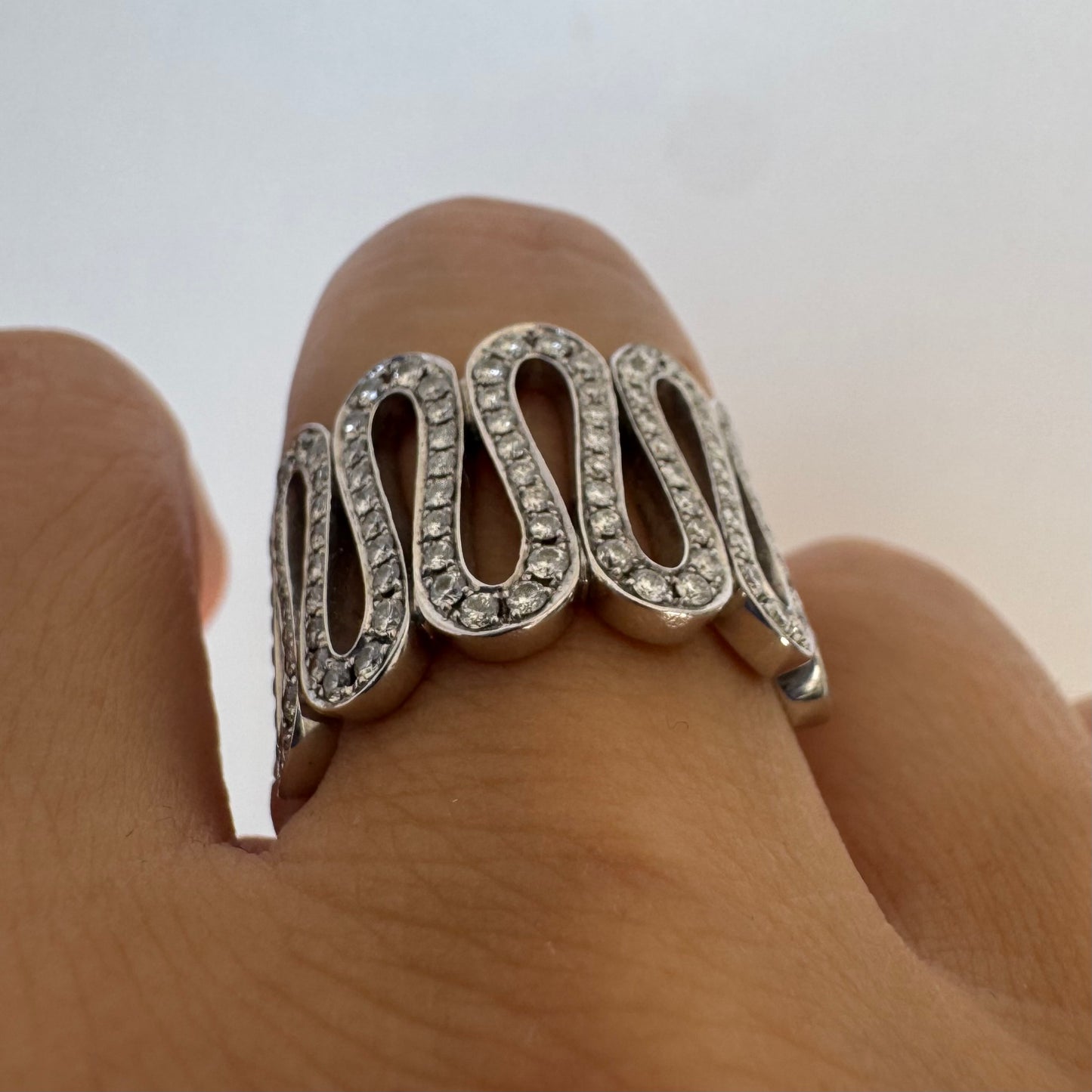 14K gold ring set with shimmering Diamonds in a flowing wave design