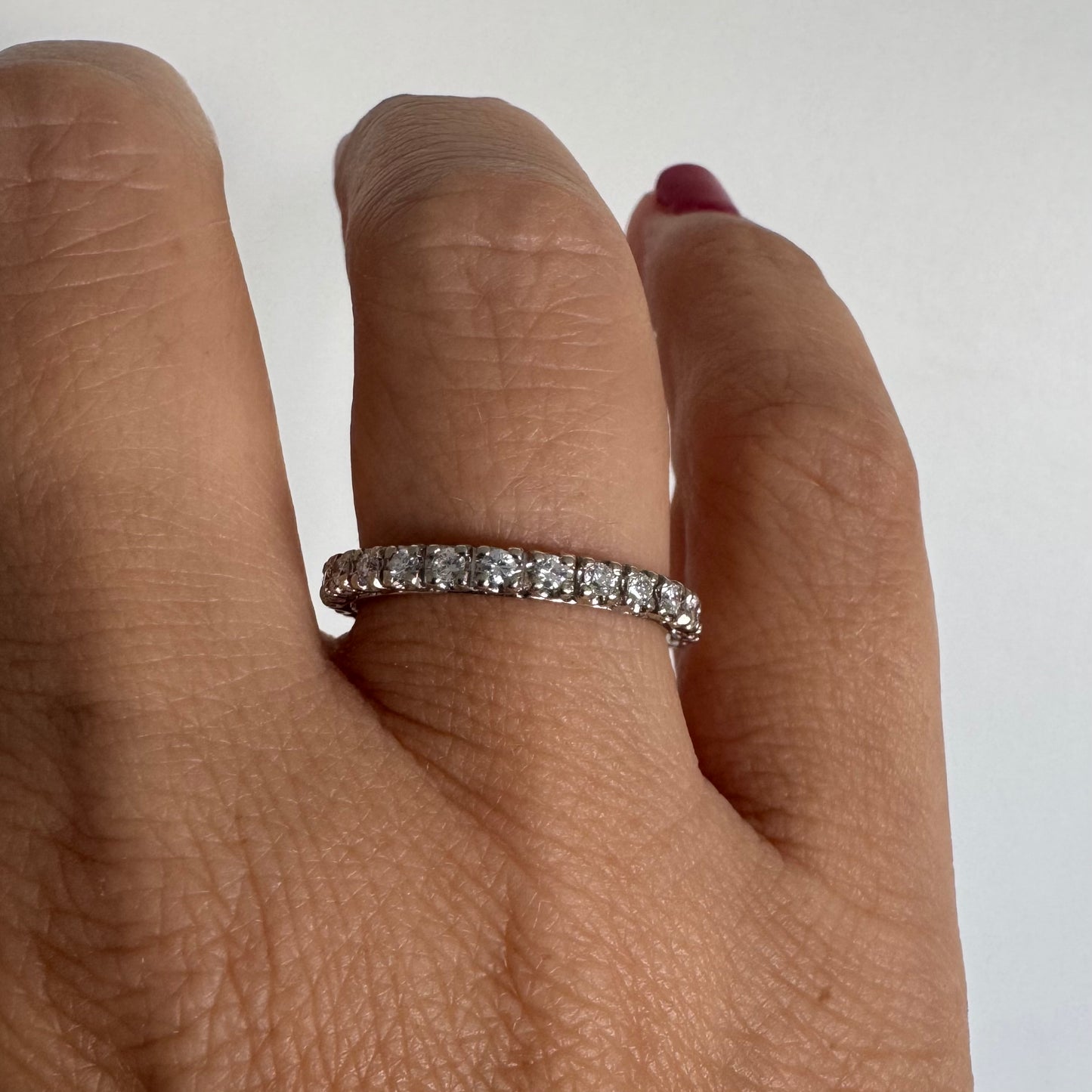 Classic 14K gold eternity ring set with a full circle of sparkling Diamonds