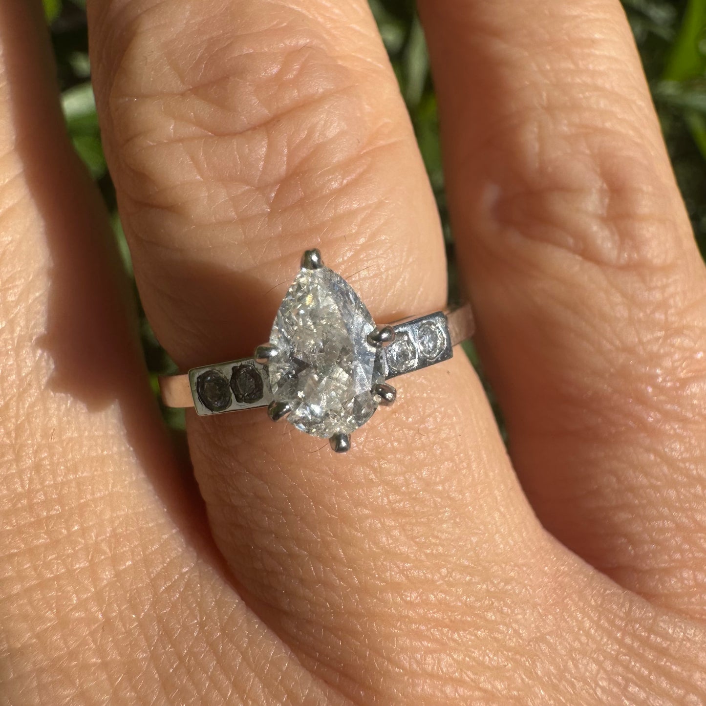 Platinum ring set with one center Pear cut Diamond & side Diamonds