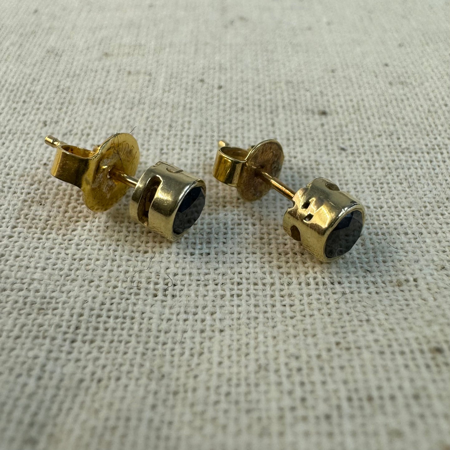 14K gold stud earrings set with Black Diamonds