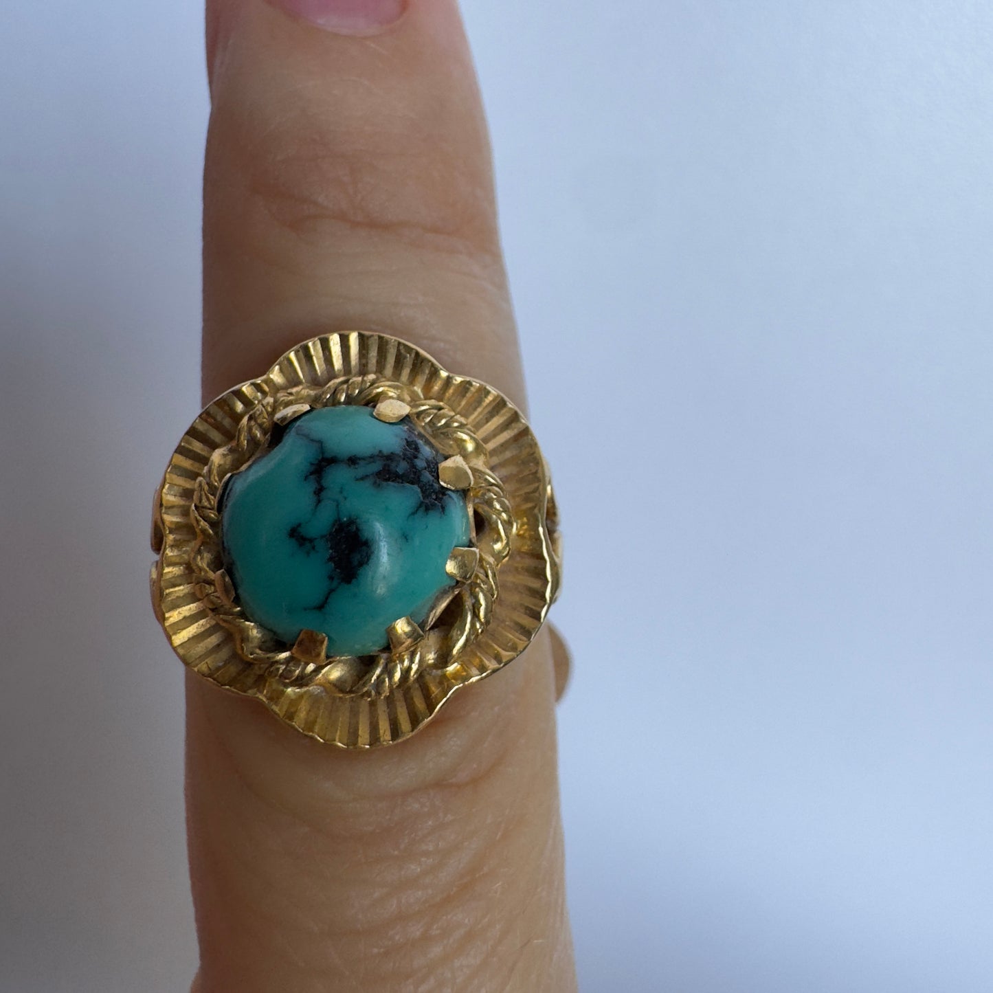 18K gold ring set with a unique Turquoise
