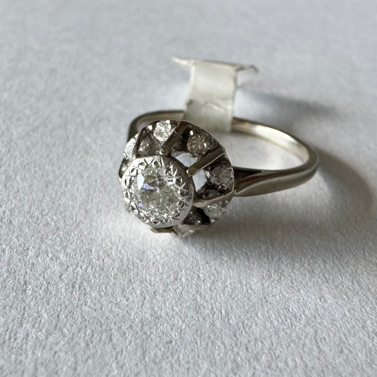 18K gold ring set with Diamonds in     a classic cluster-style