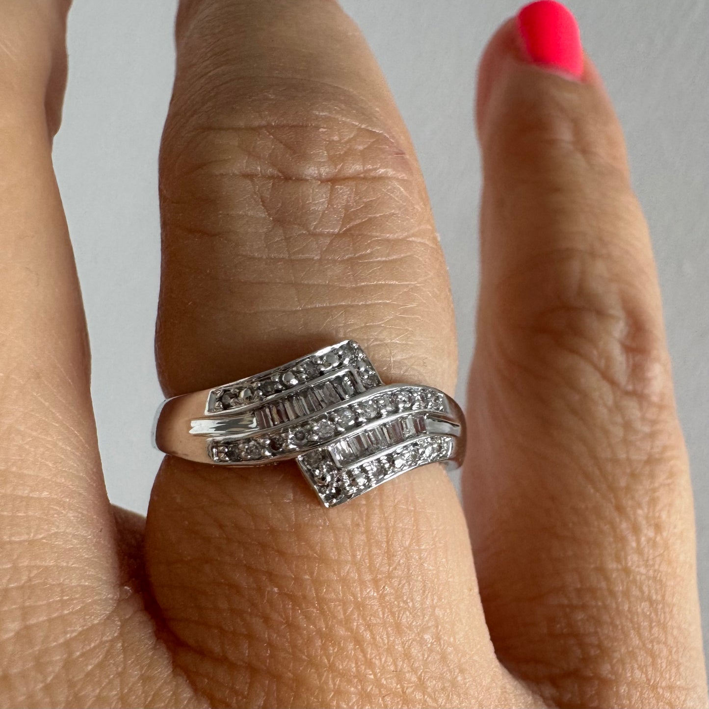9K gold ring set with natural Diamonds in a unique geometric design.