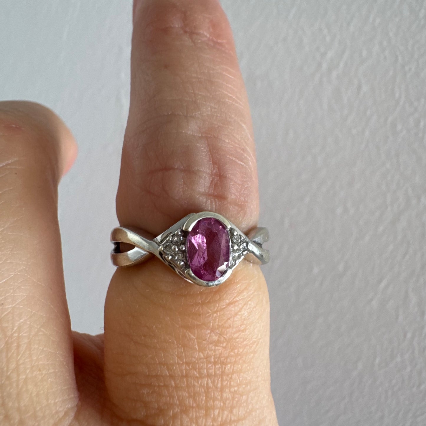 9K gold ring set with a pink center stone