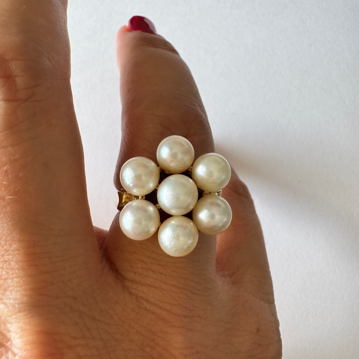 14K gold ring set with seven round Pearls in a bold floral cluster