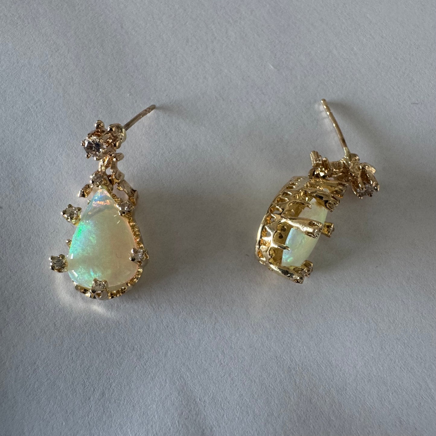 14K gold drop earrings set with pear-shaped Opals and Diamonds.
