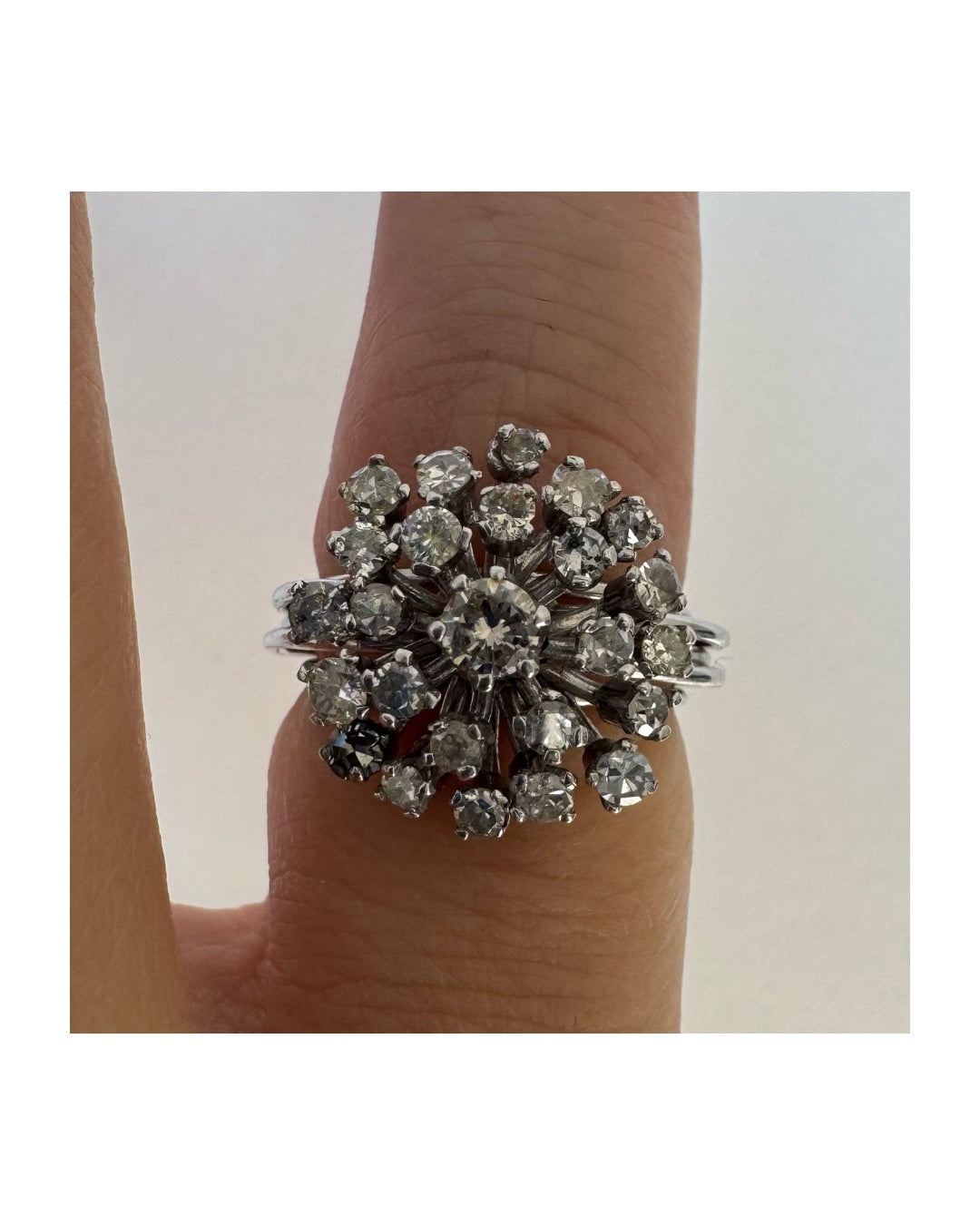 14K gold ring set with a cluster of sparkling Diamonds in a rich floral-inspired design.