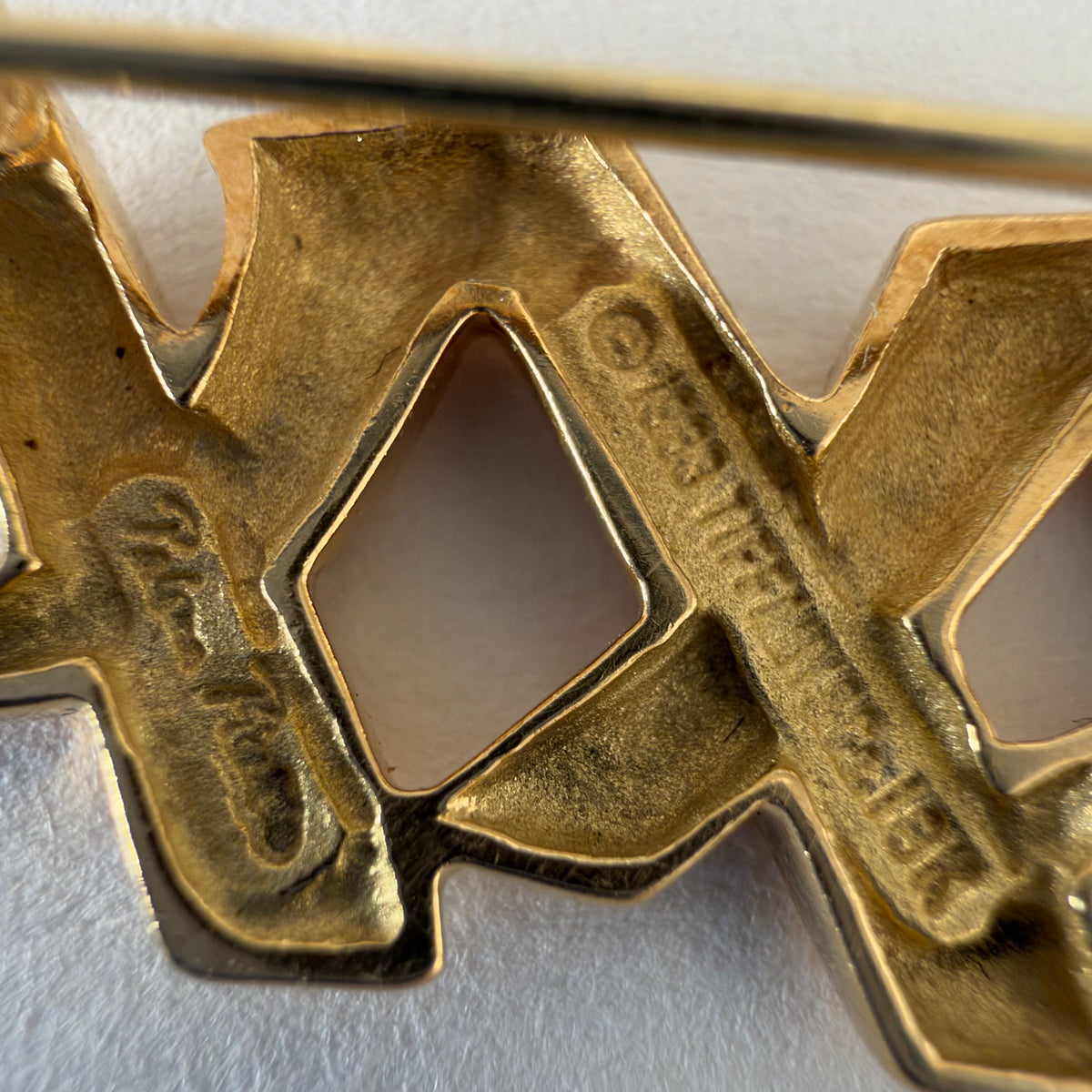 A Tiffany & Co. 18K gold brooch designed by Paloma Picasso from the iconic Graffiti Collection.
