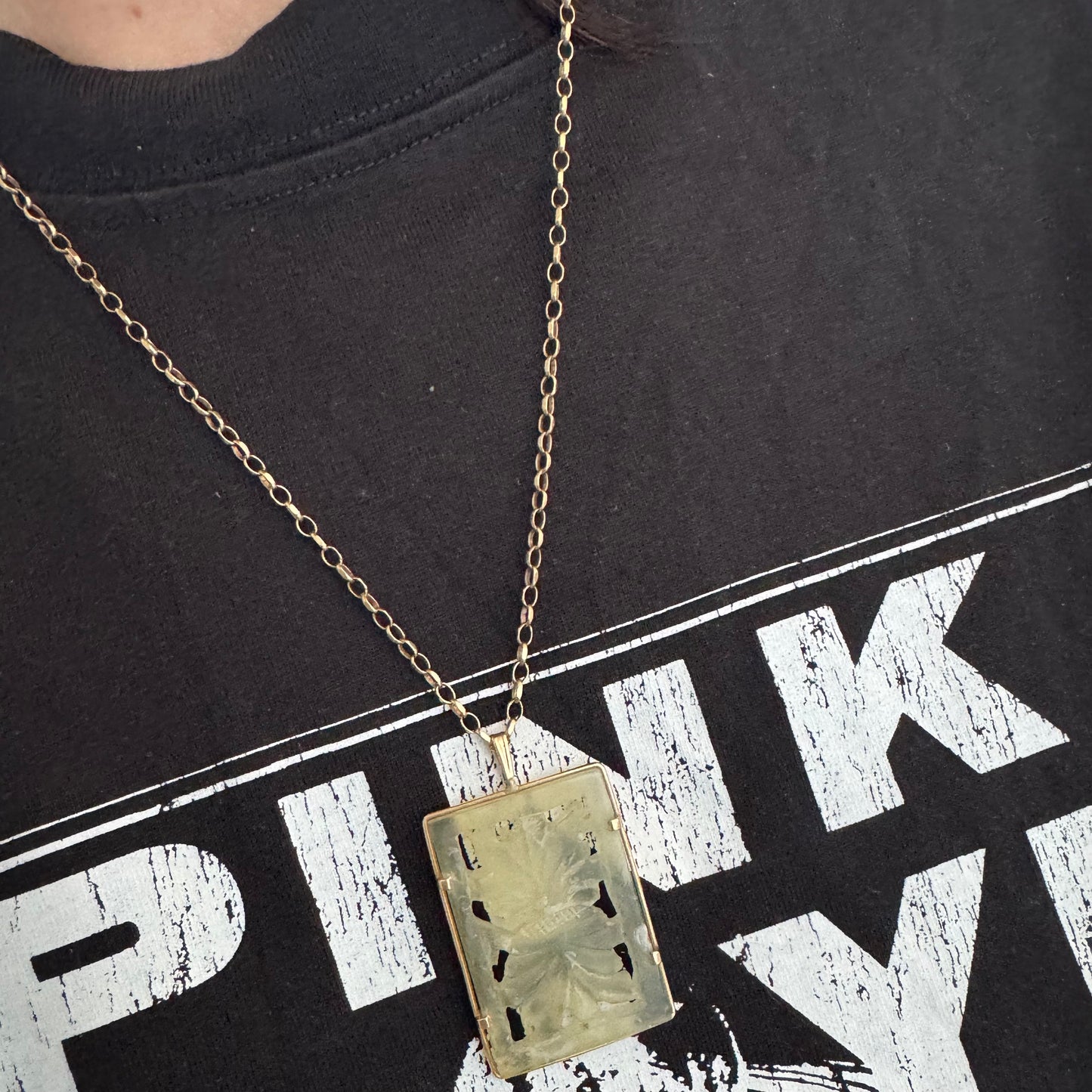 14K gold rectangular pendant set with a hand-carved milky Jade stone