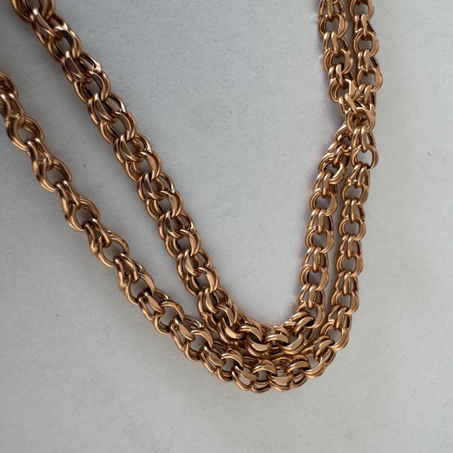 14K gold chain featuring an intricate woven link