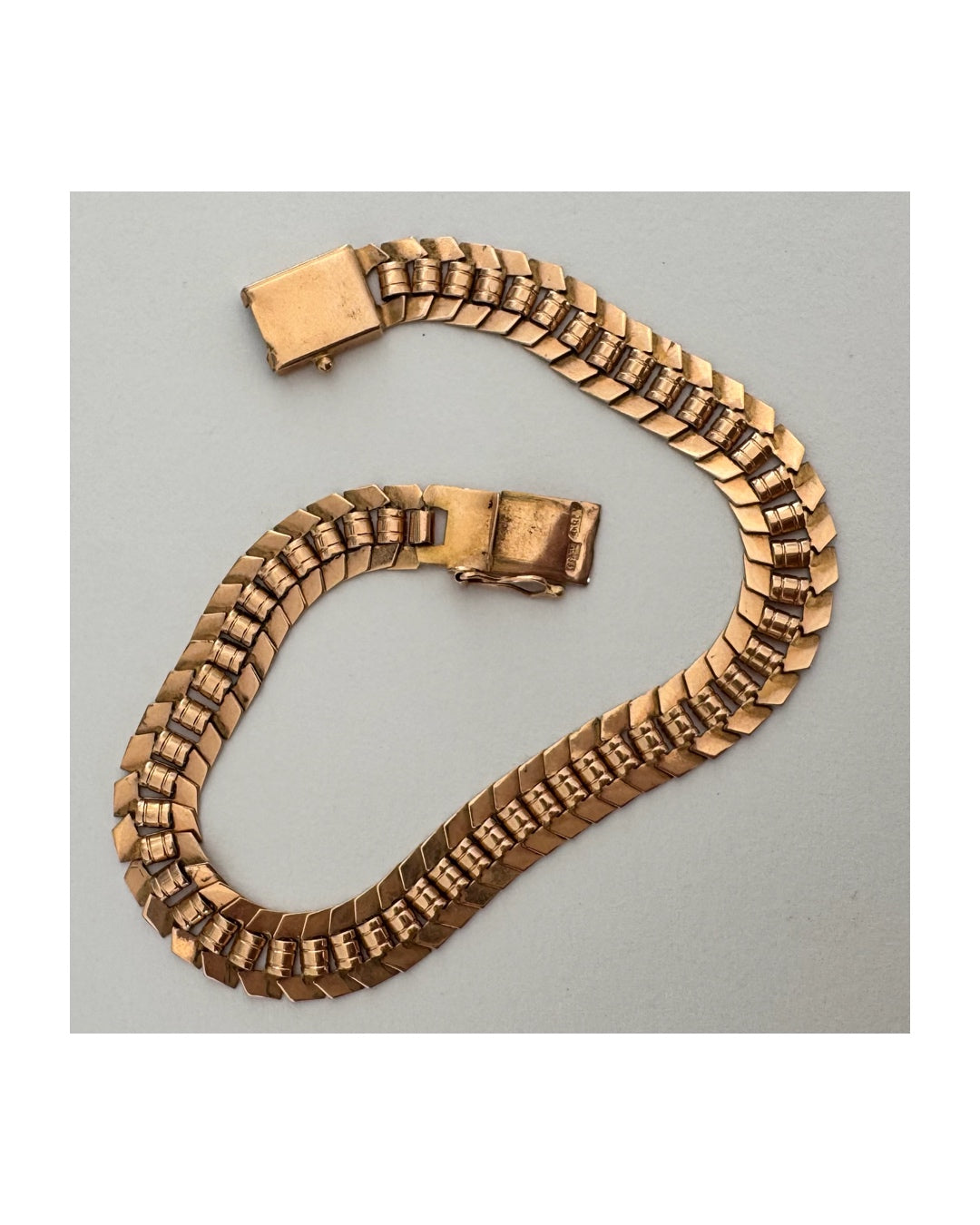 14K gold bracelet with a bold, flexible link design and a secure box clasp.