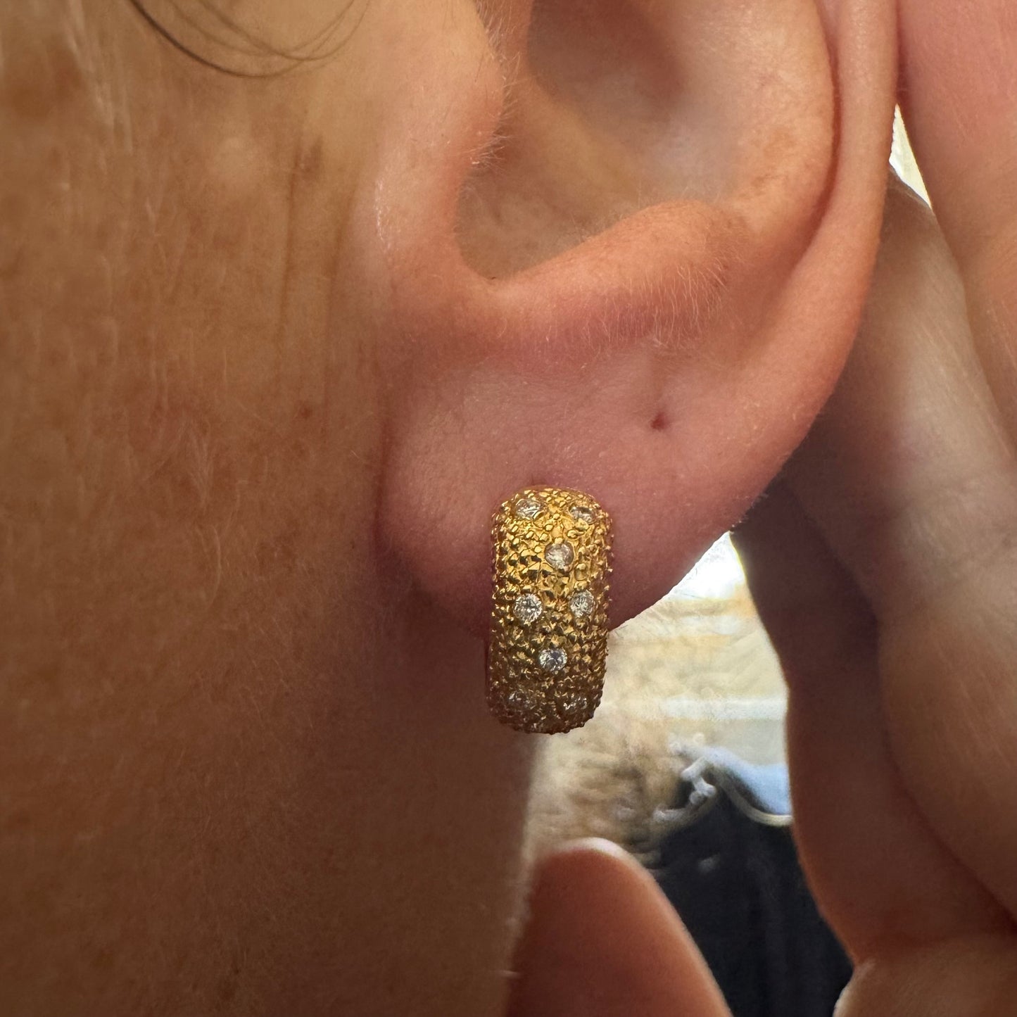 18K gold hoop earrings designed with a rich organic texture and set with Diamonds