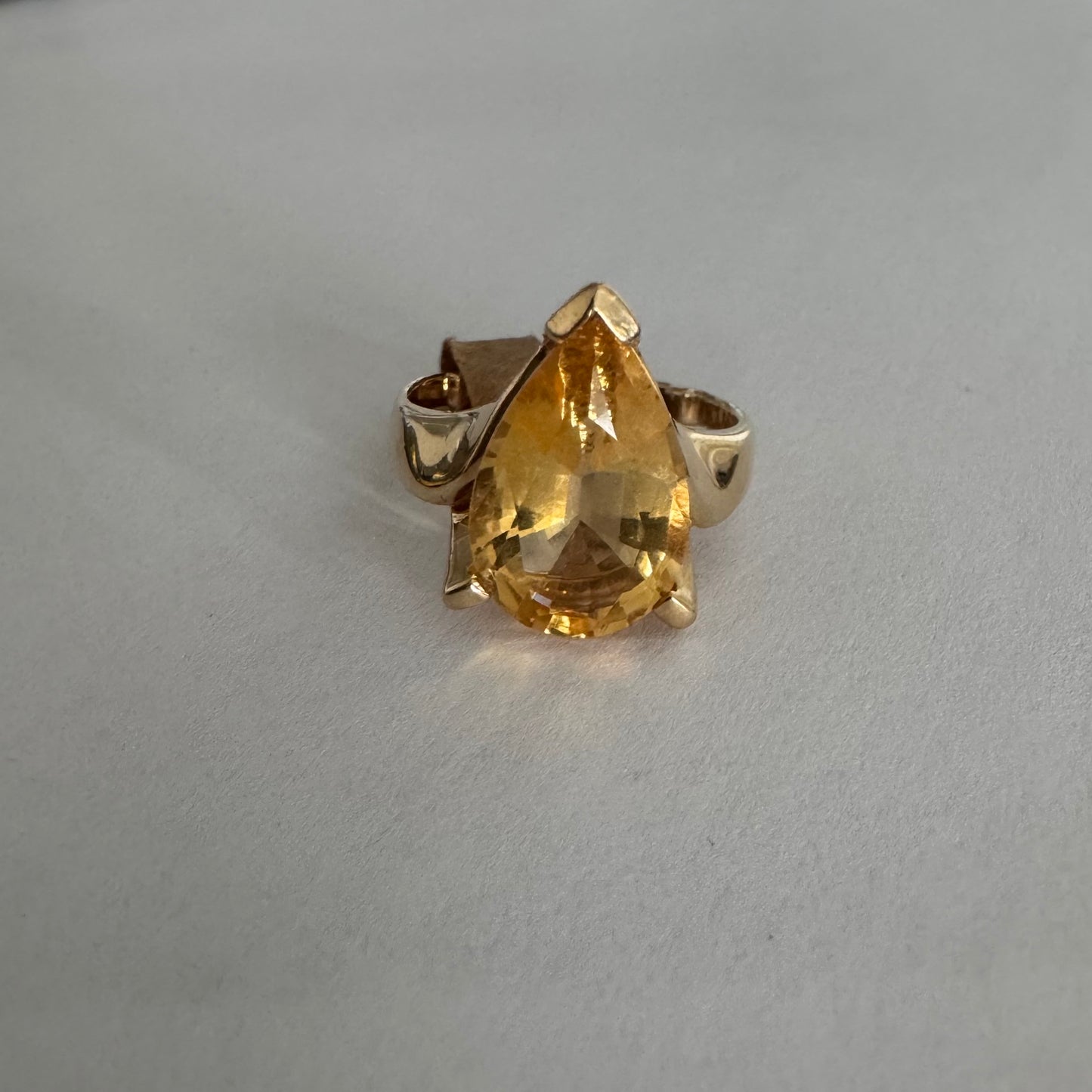 14K gold ring set with a large pear-shaped Citrine