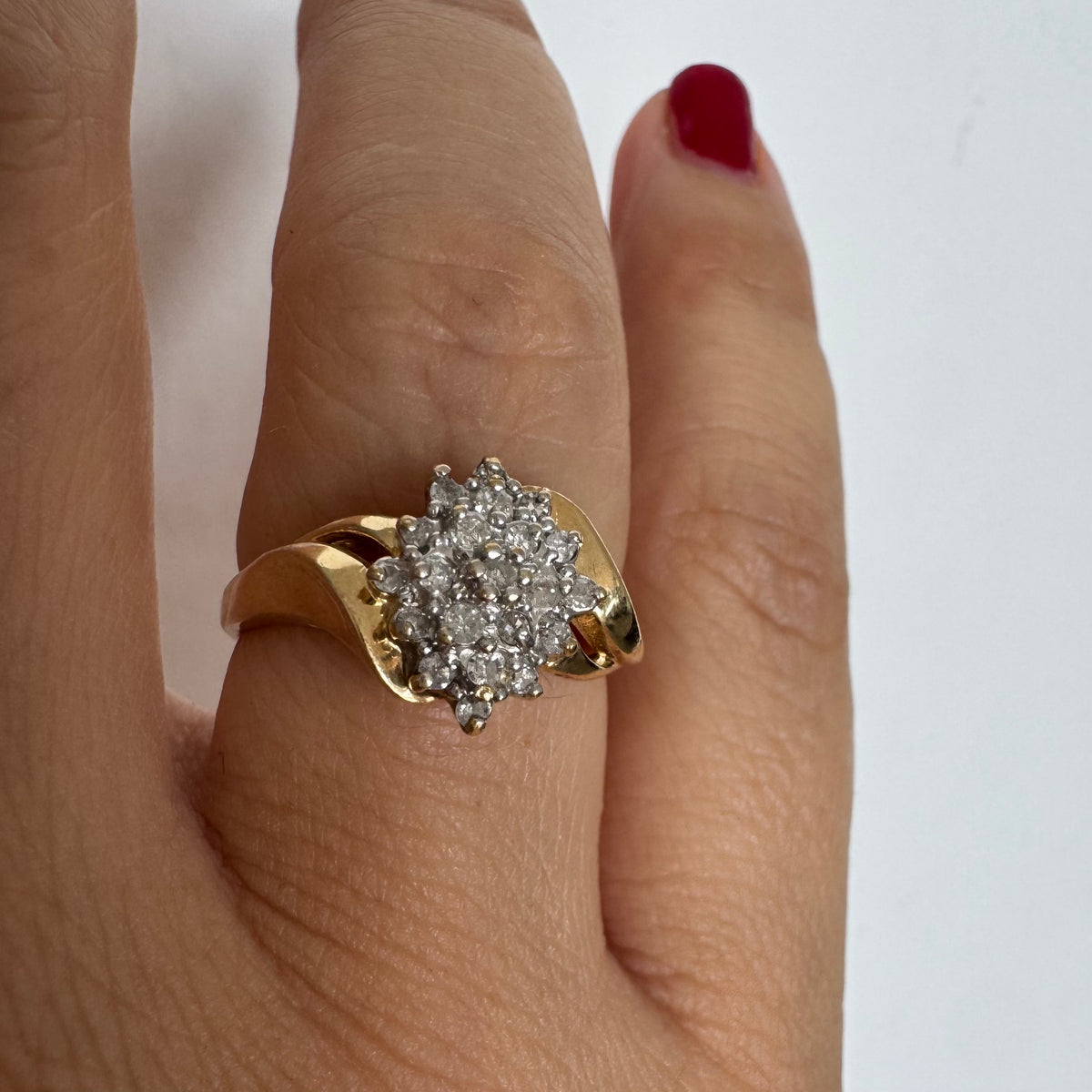 10K gold ring set with Diamonds, featuring a classic design with soft, flowing curves.