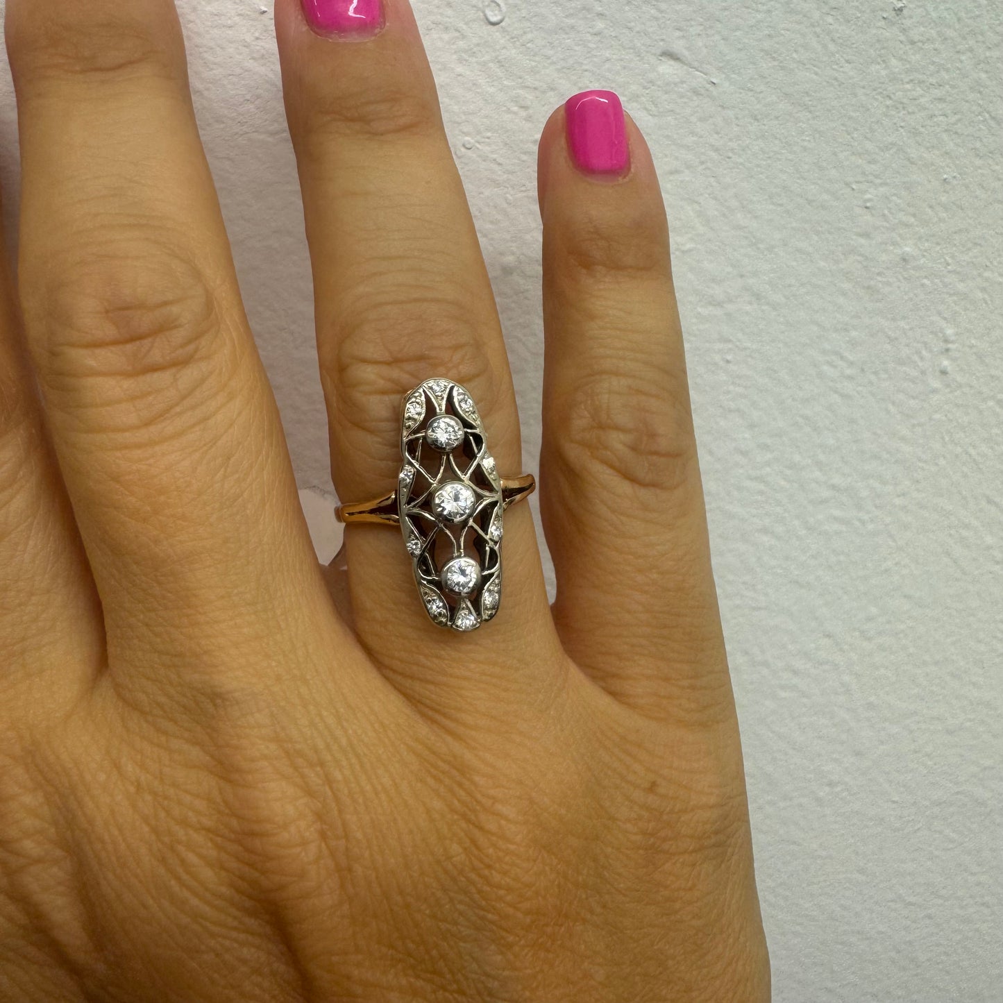 14K gold ring set with diamonds in an elongated openwork design