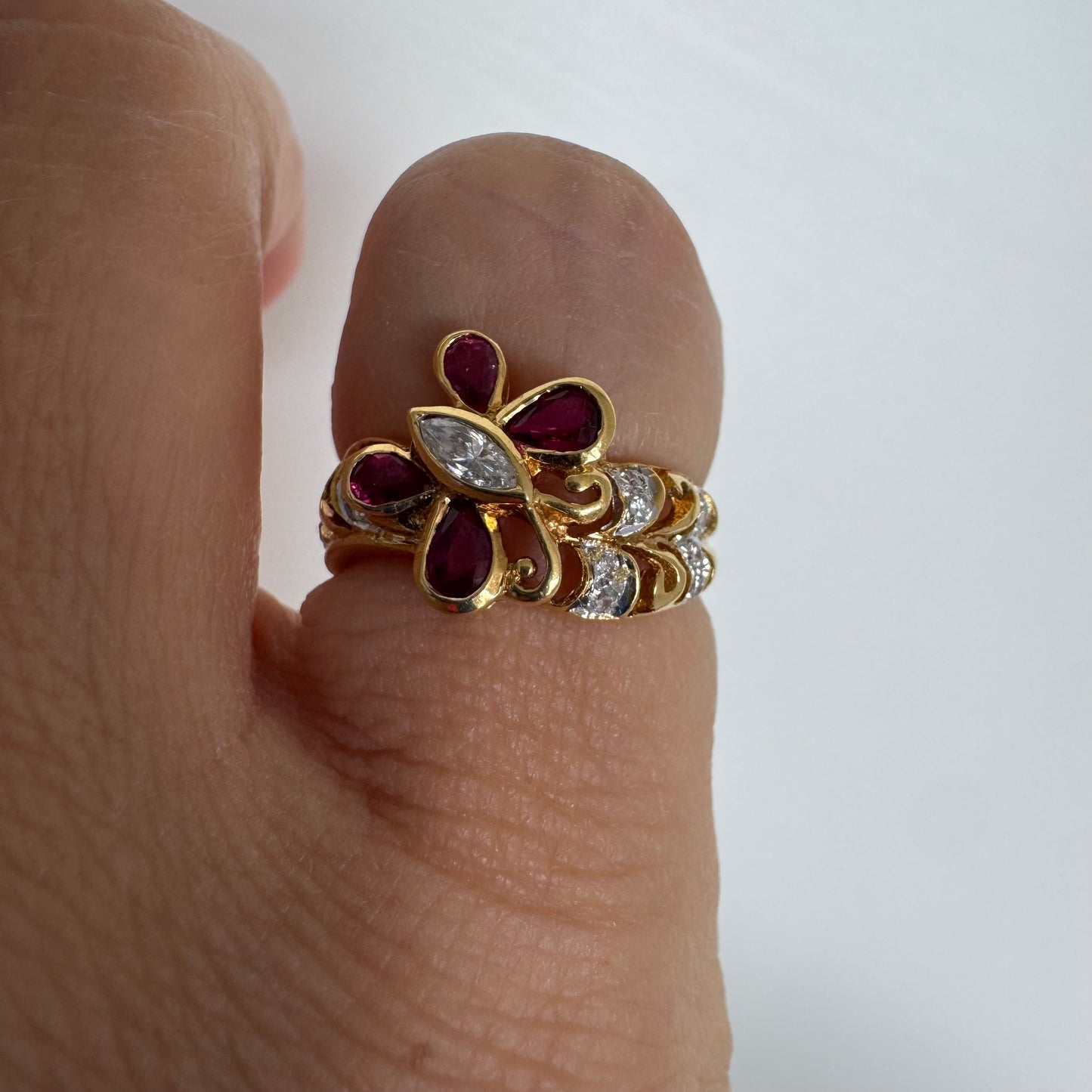 18K gold butterfly ring set with pear-cut Rubies & a marquise-cut Diamond at its center