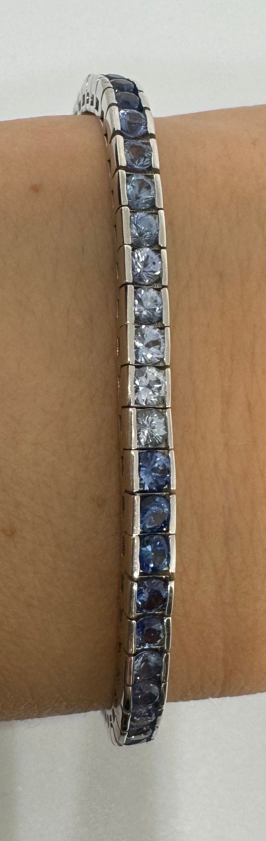 14K gold Tennis Bracelet set with different shades of Sapphire