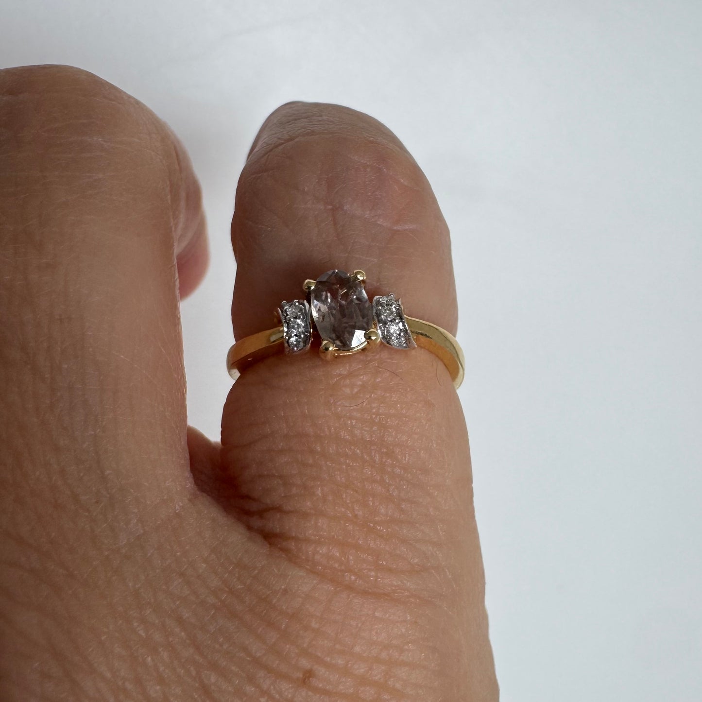 18K gold ring featuring a captivating oval Smoky Quartz & side Diamonds