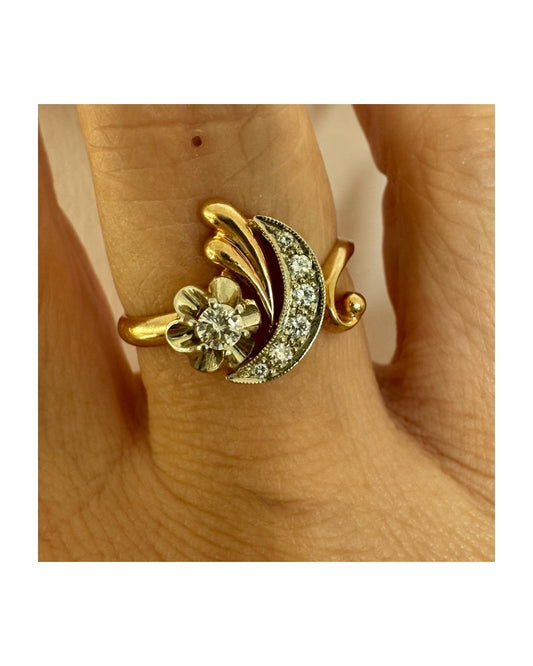 14K gold ring with a delicate moon and star motif set with Diamonds