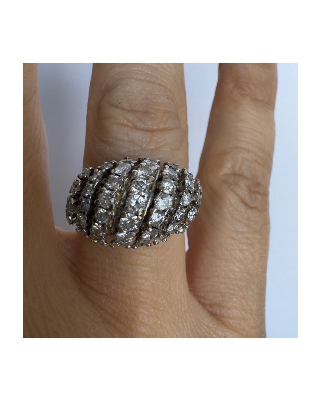 18K gold ring set with rows of sparkling Diamonds in a bold, sculptural design