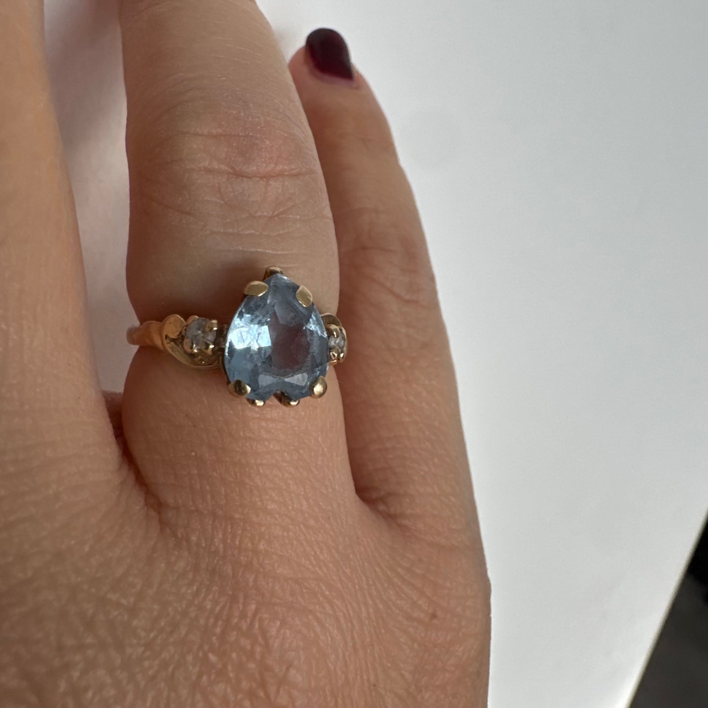 14K gold ring set with a heart-cut Blue Topaz stone