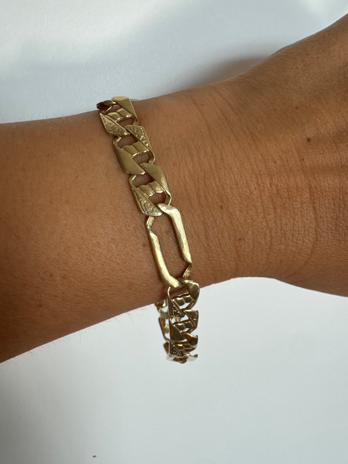 14K gold bracelet with a modern, distinctive link design