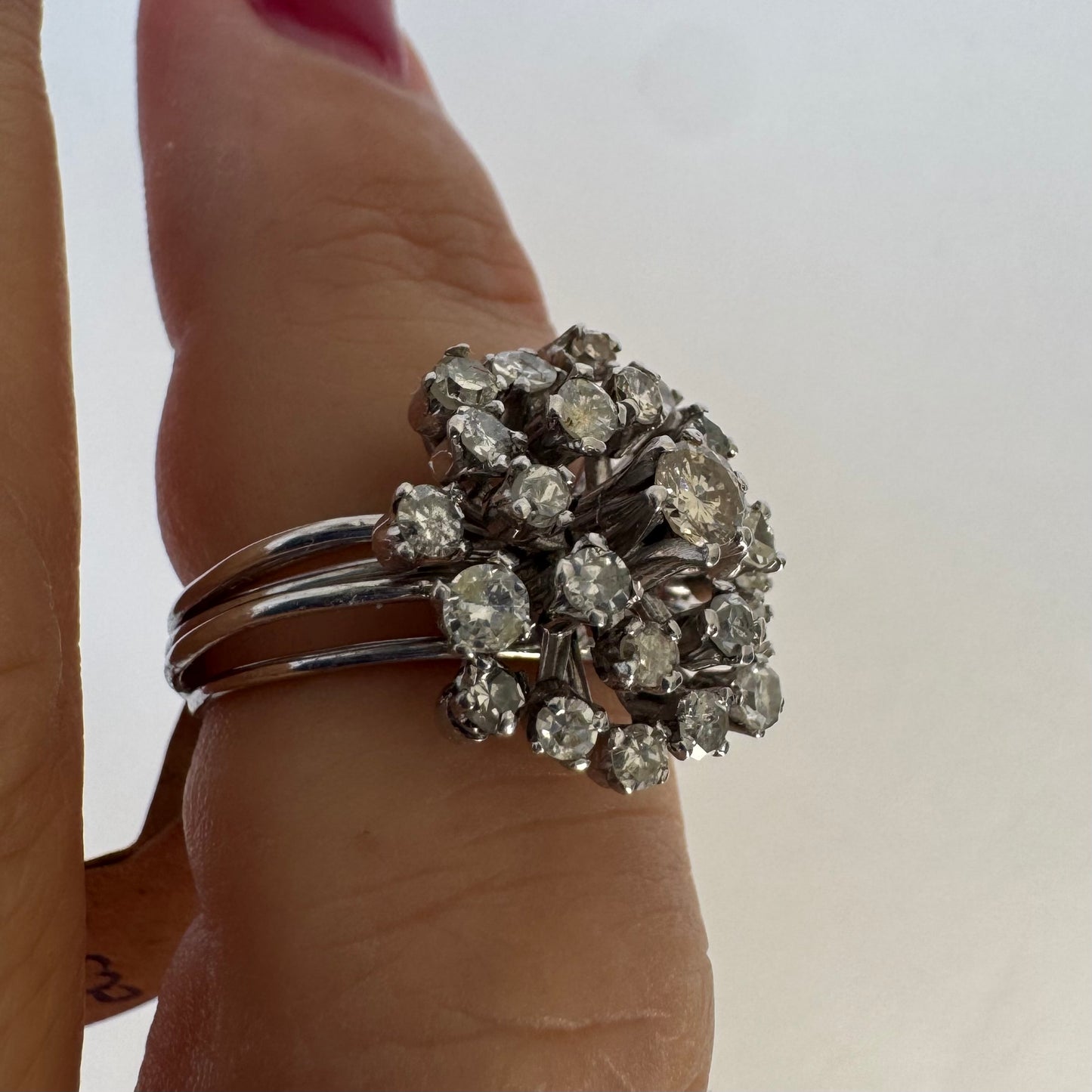 14K gold ring set with a cluster of sparkling Diamonds in a rich floral-inspired design.