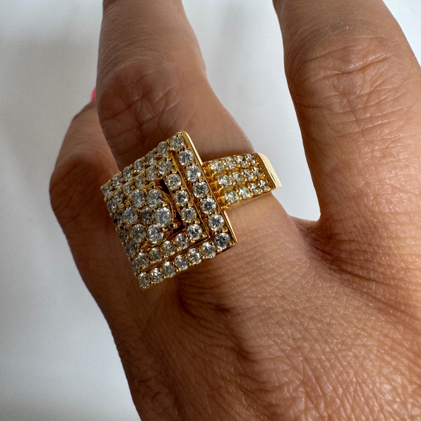 10K gold ring featuring a bold geometric design beautifully set with sparkling Diamonds