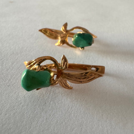14K gold earrings designed with a floral and leaf motif, set with a natural Turquoise