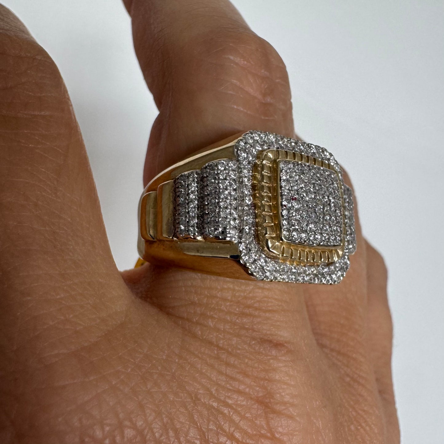 10K gold ring set with sparkling Diamonds in a bold geometric design.