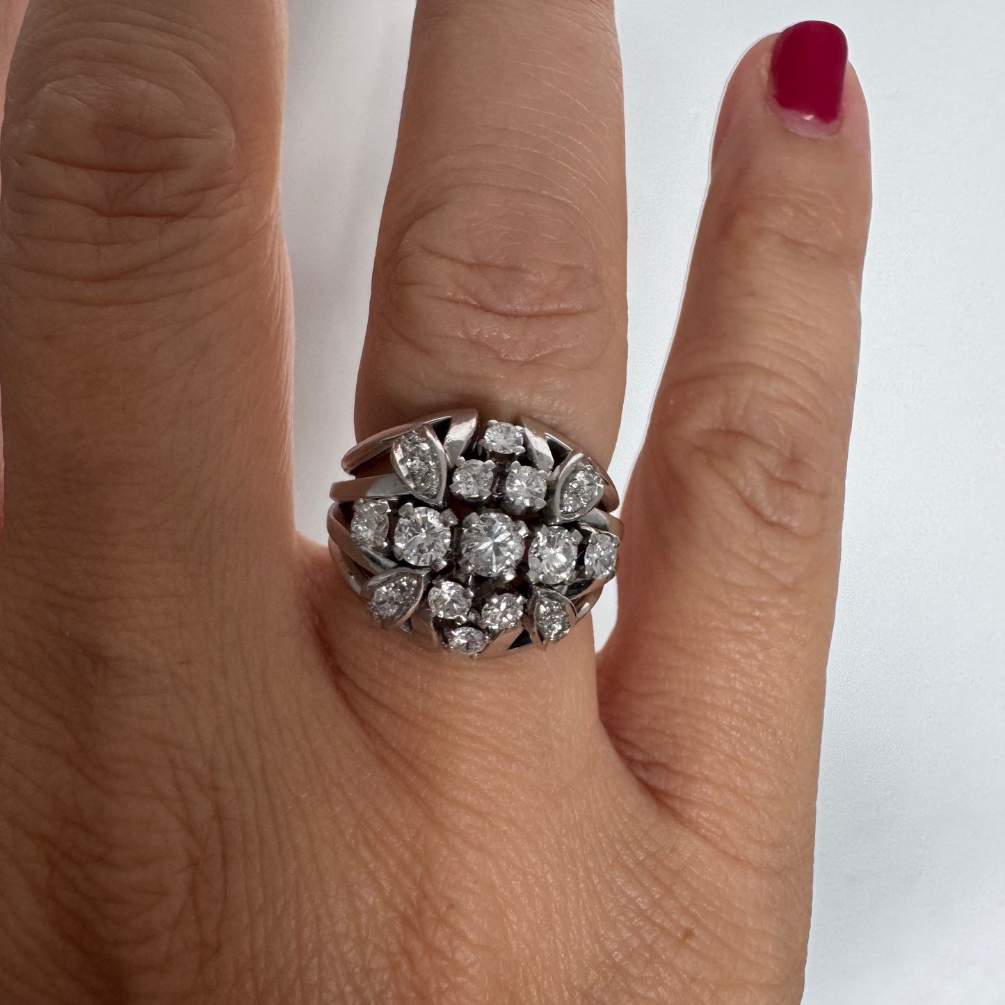 Platinum ring set with Diamonds in a bold, multi-layered floral design.