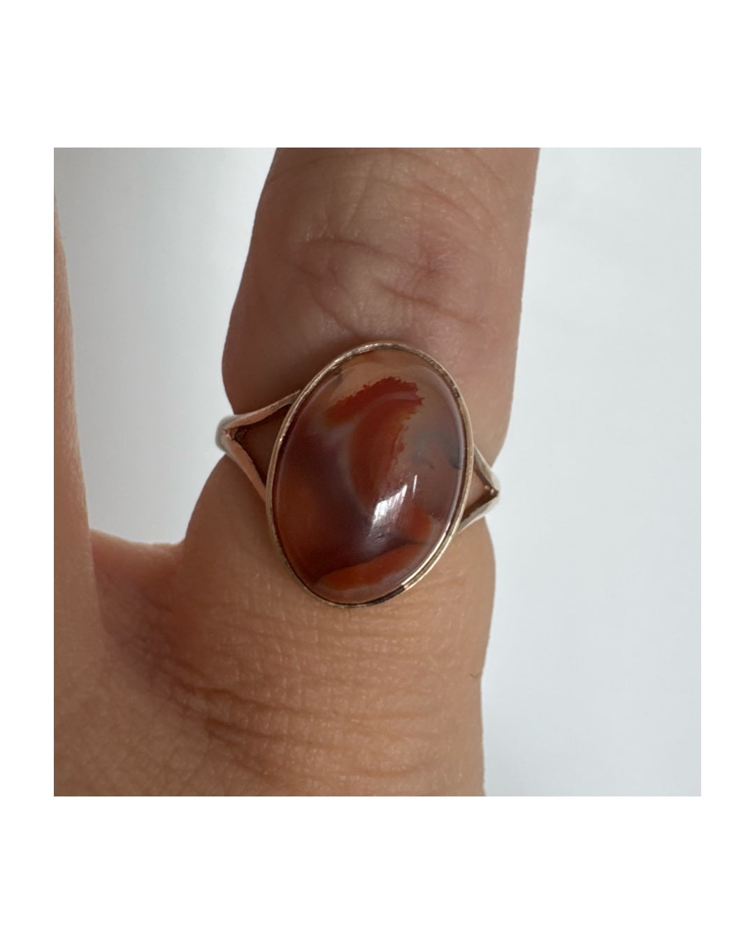 9K gold ring set with a warm reddish-brown stone featuring beautiful natural patterns